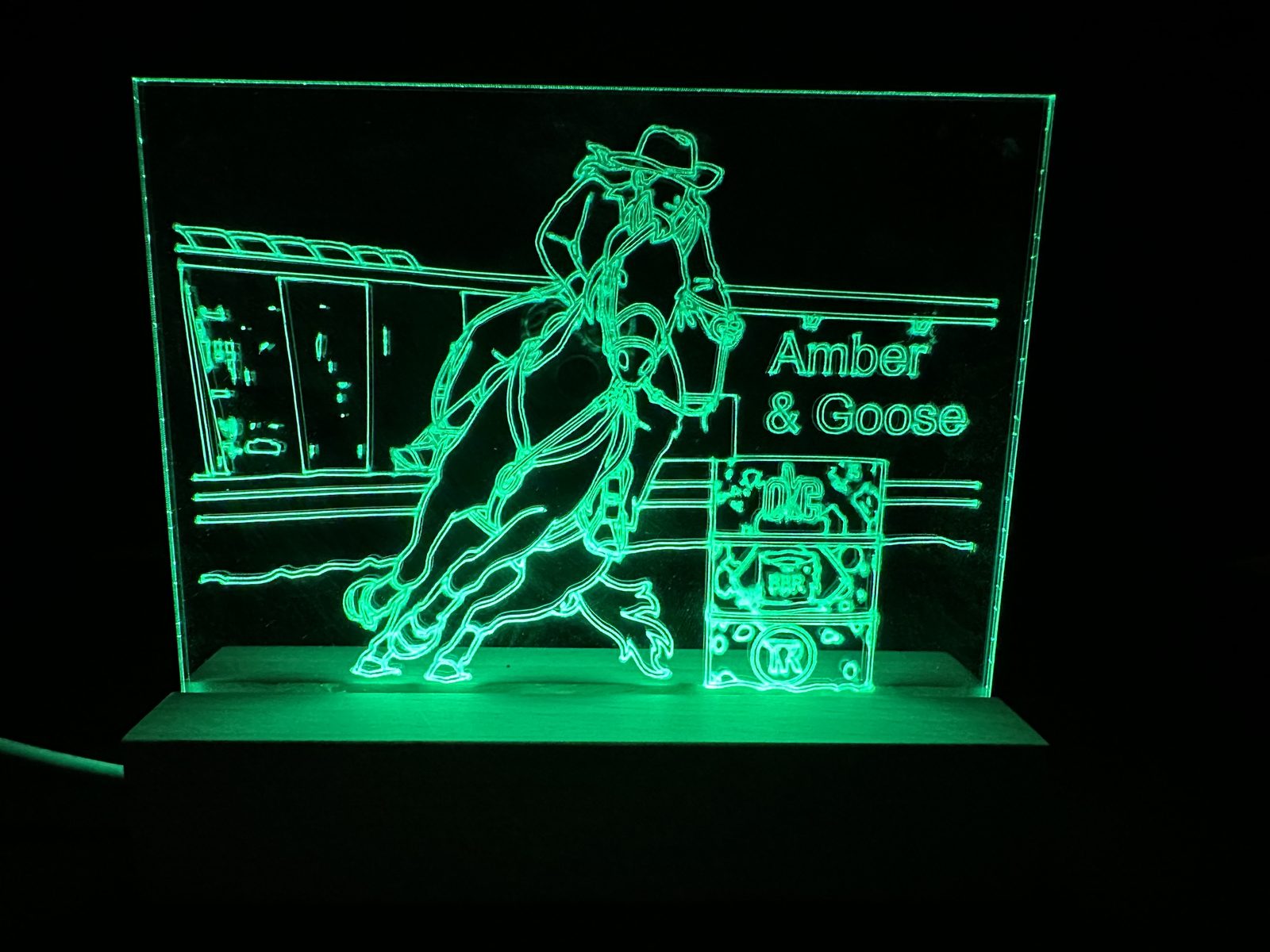 Laser-marked acrylic piece with green LED edge lighting