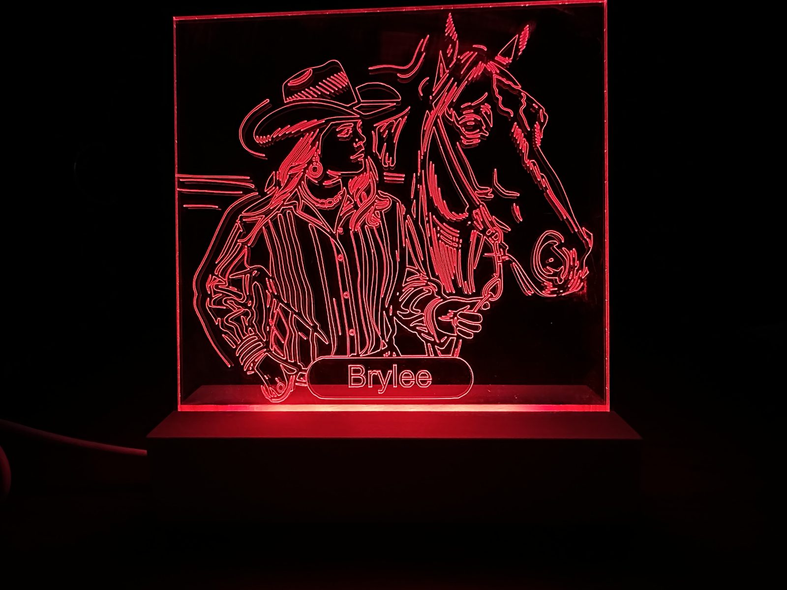 Laser-marked acrylic with red LED edge lighting showing personalized name Brylee